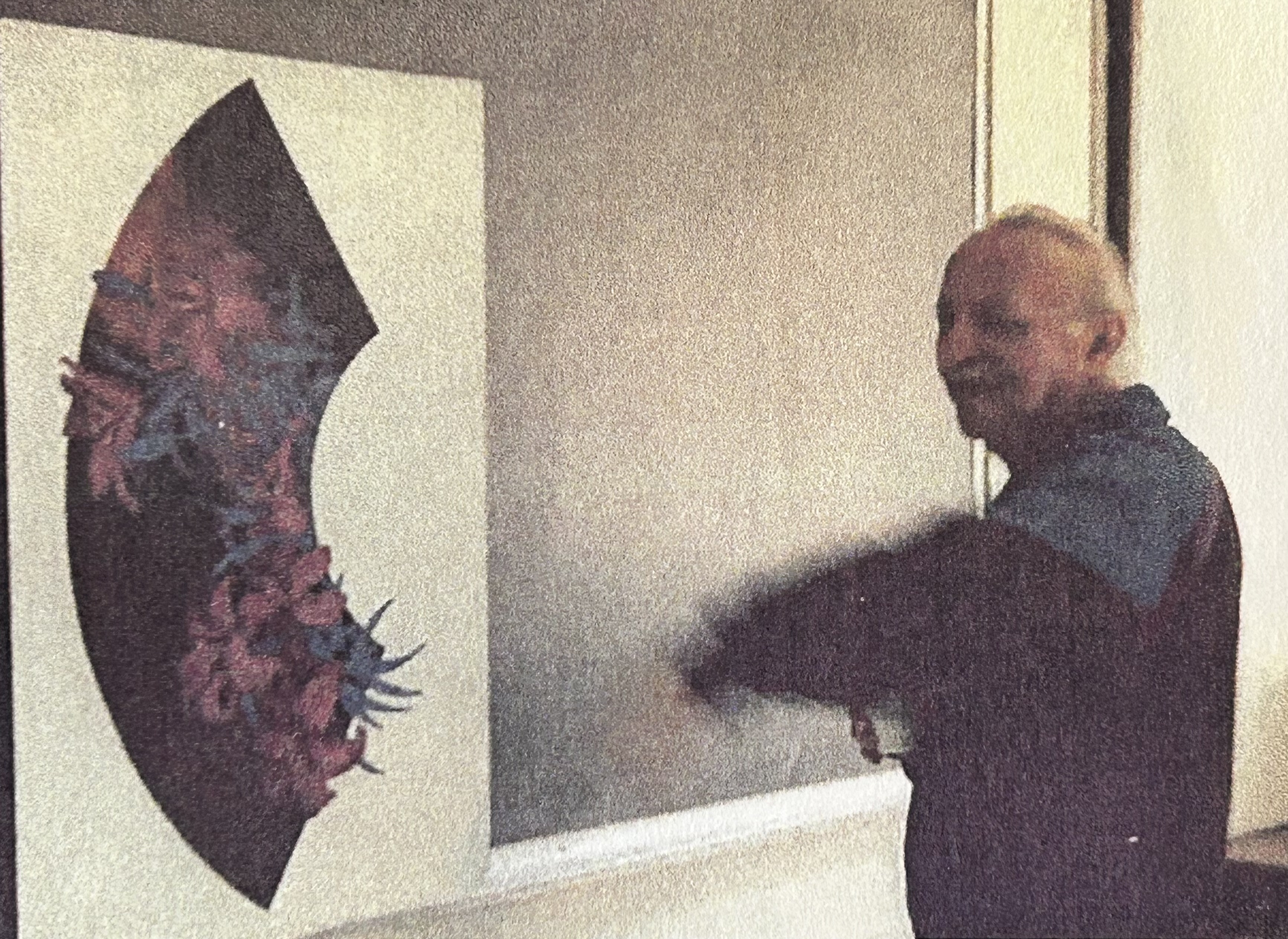 Bakasan with one of his paintings
